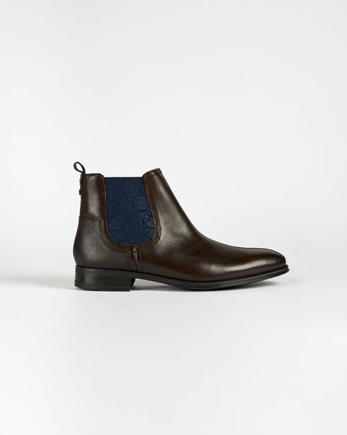 <P Class="Description">A Staple Pair For The Modern Gent, Our Tradd Boots Give Any Ensemble A Classic Upgrade. Crafted Fro...